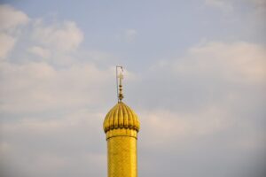 gold and white dome building under white clouds during daytime scaled lfFD5s
